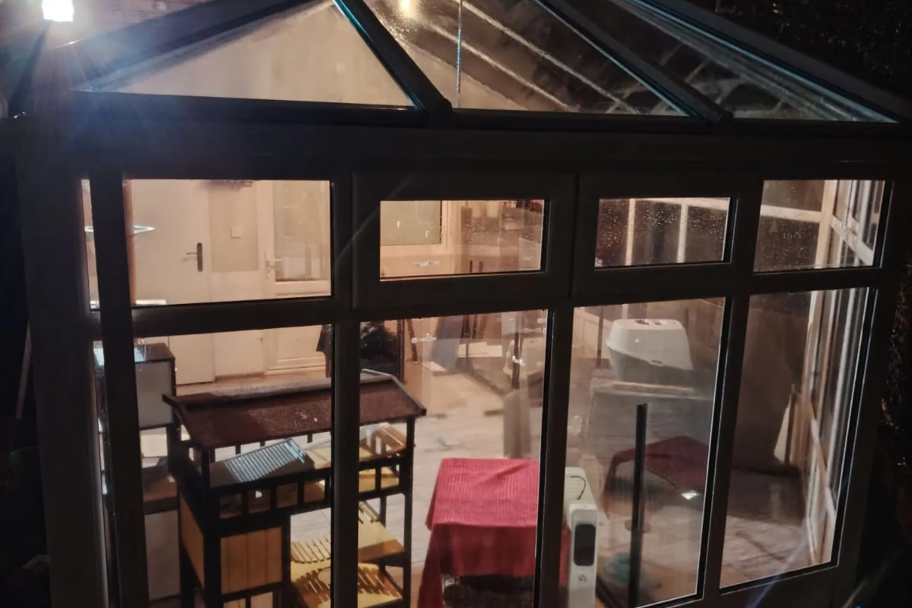 A conservatory seen from inside with clear panels, Conservatory Cleaning in Birmingham