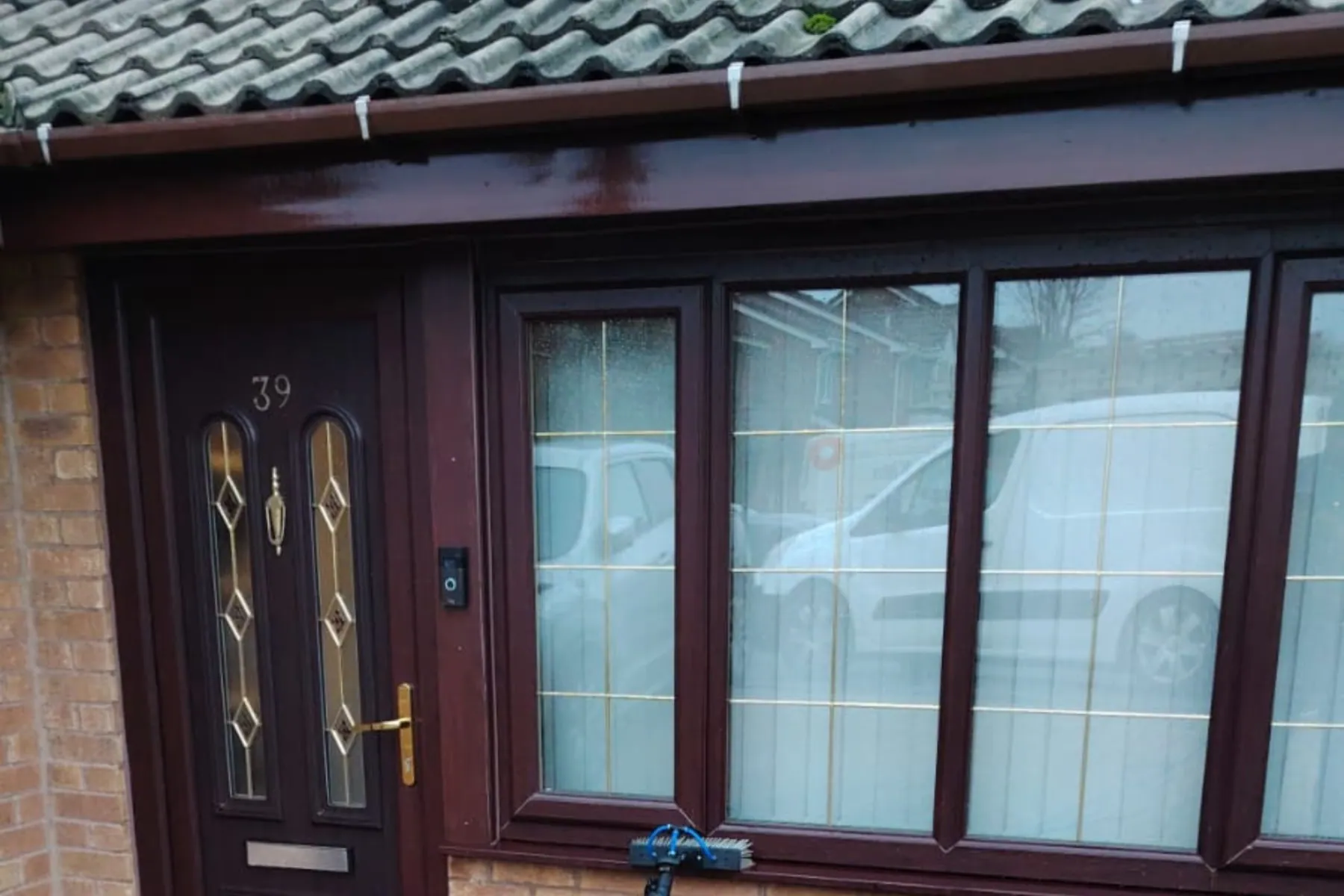 A dark wood front door and windows after cleaning, Window Cleaning in Birmingham