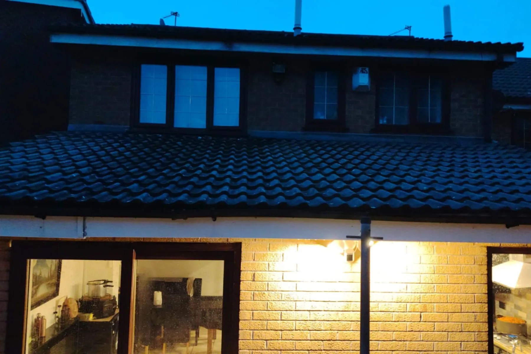 A house at dusk with freshly cleaned windows, Window Cleaning in Birmingham