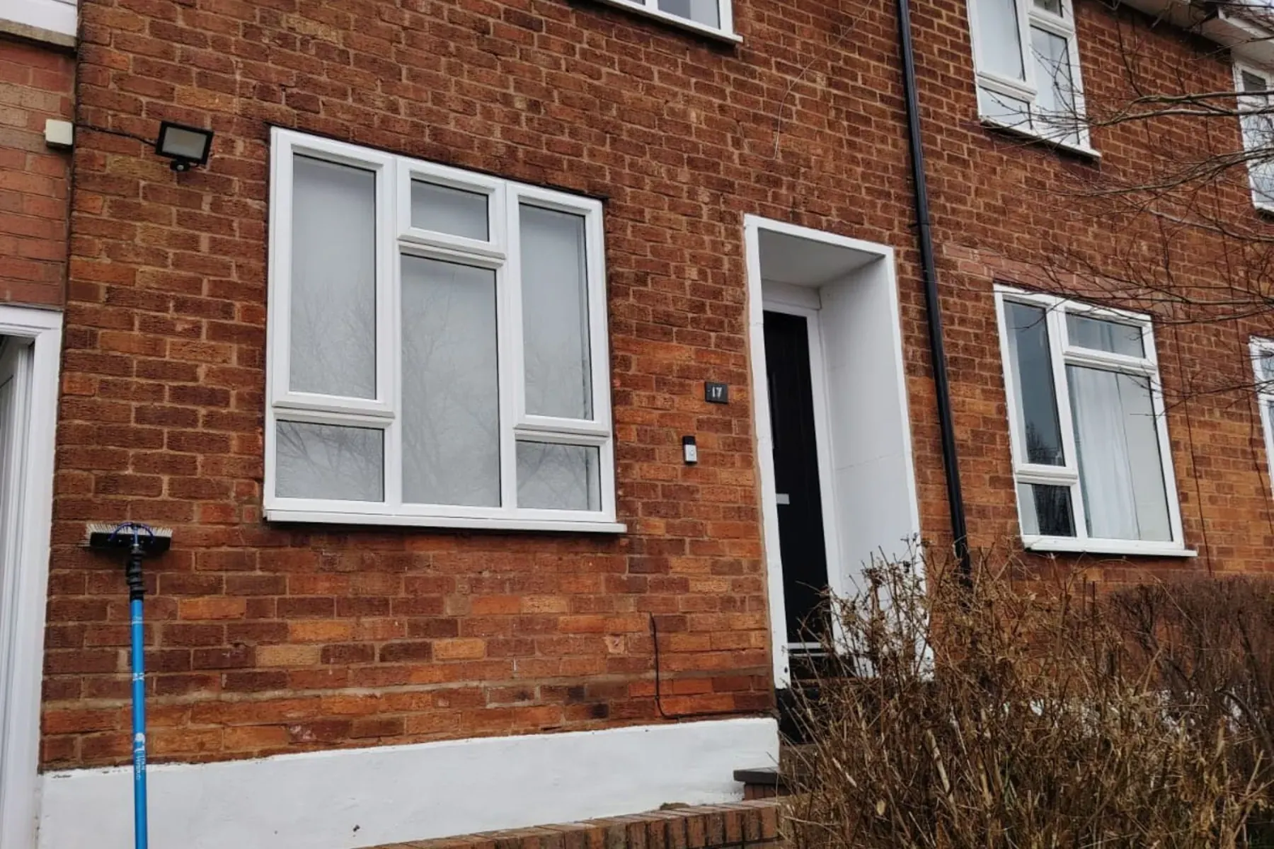 A pole against the front of a brick semi, worked from the ground, Gutter Cleaning in Birmingham